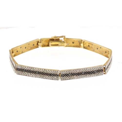 2889 - 9ct gold black and white diamond three row bracelet, 17cm in length, approximate weight 8.0g