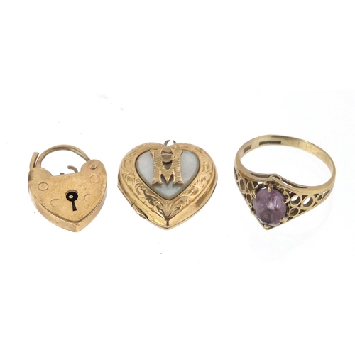 2919 - 9ct gold pink stone ring, 9ct gold love heart padlock and a gold back and front locket, approximate ... 