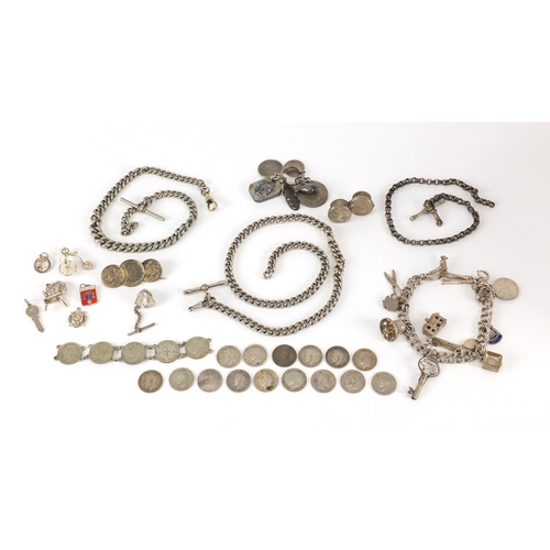 3031 - Silver and white metal jewellery including charm bracelets, watch chains and coins, approximate weig... 