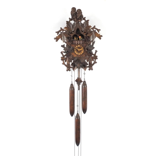 2171 - German Black Forest cuckoo clock with Roman numerals by Regula, carved with birds, foliage and berri... 
