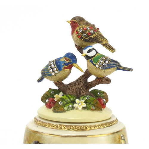 2576 - Two Bradex tranquil garden musical birds, the largest 13cm high