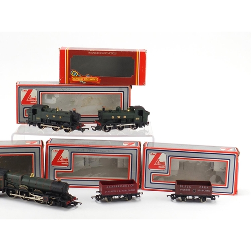 2640 - OO gauge model railway with boxes comprising two Lima locomotives, Hornby locomotive and two Lima ad... 