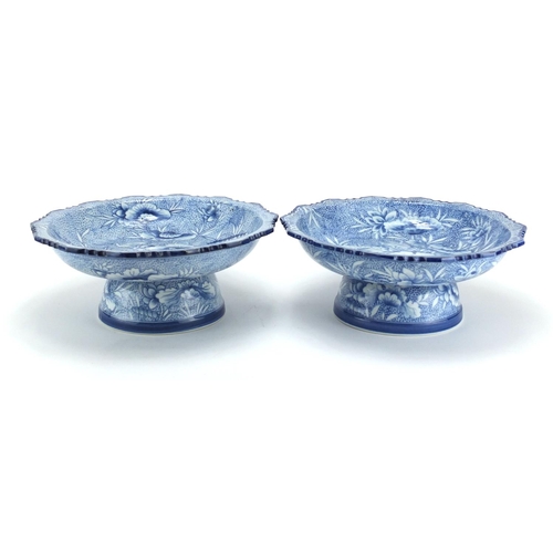 2483 - Near pair of Japanese blue and white porcelain pedestal dishes, hand painted with flowers, each 12.5... 