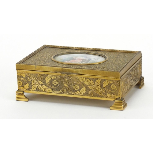 2722 - French ornate brass musical jewel box, the hinged lid inset with an oval panel hand painted with lov... 