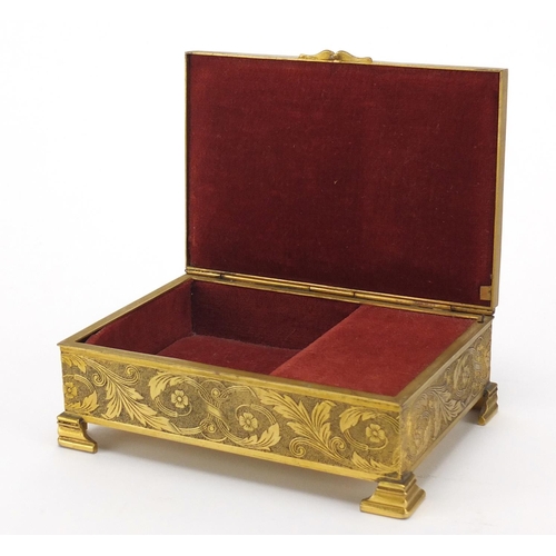 2722 - French ornate brass musical jewel box, the hinged lid inset with an oval panel hand painted with lov... 