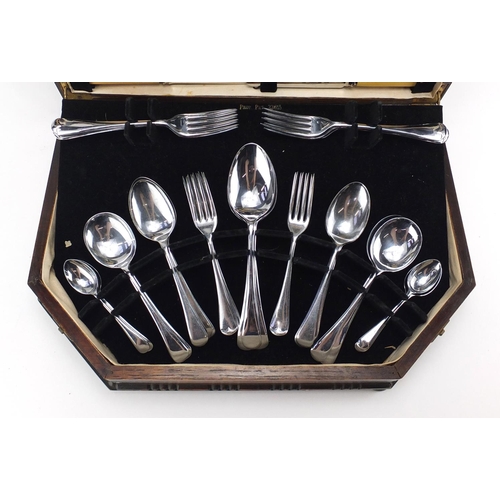 2170 - 1920's oak six place canteen of stainless steel cutlery, some with ivorine handles, the canteen 46cm... 