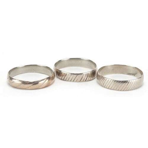 2786 - Three silver coloured metal Bedouin tribal bangles, each approximately 6.7cm in diameter