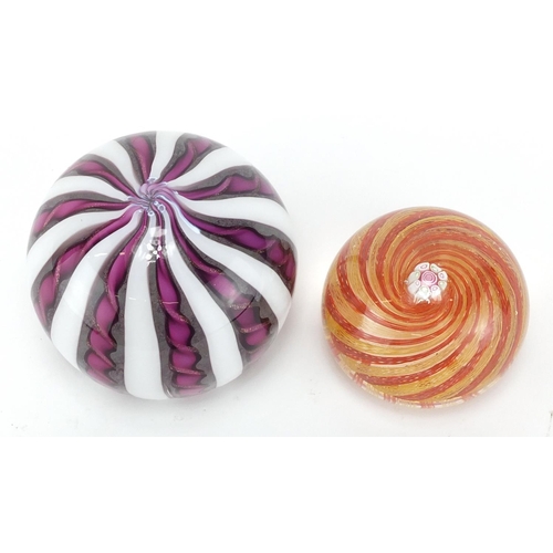 2205 - Two Murano glass paperweights including a twisted ribbon design example, the largest 6.5cm high