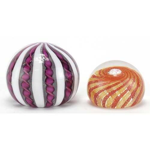 2205 - Two Murano glass paperweights including a twisted ribbon design example, the largest 6.5cm high