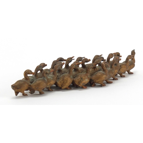 2285 - Painted bronze flock of ducks, 22cm in length