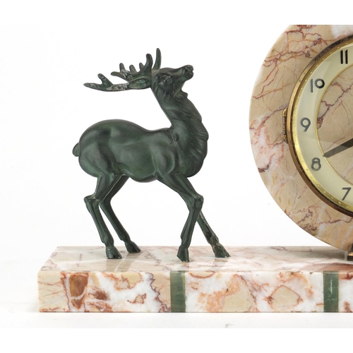 2343 - Art Deco marble and onyx mantel clock, mounted with two bronzed deer's, the dial with Arabic numeral... 