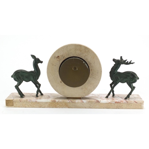 2343 - Art Deco marble and onyx mantel clock, mounted with two bronzed deer's, the dial with Arabic numeral... 