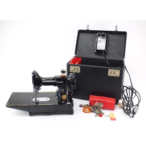2169 - Singer Featherweight sewing machine, model 222K with tools and case