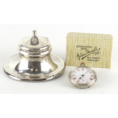 2846 - Circular silver capstan shaped inkwell and a ladies silver pocket watch with enamelled dial, the ink... 