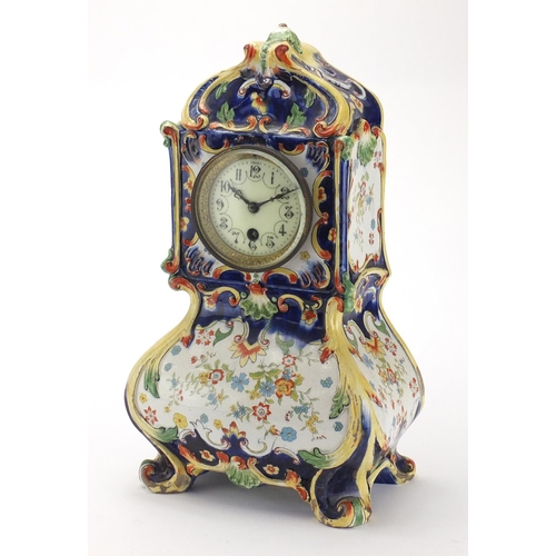 2464 - French Quimper pottery mantel clock, decorated with stylised flowers, the enamelled dial with Arabic... 