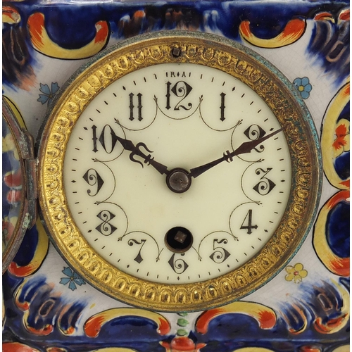 2464 - French Quimper pottery mantel clock, decorated with stylised flowers, the enamelled dial with Arabic... 