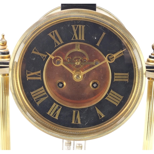 2179 - French brass drum clock striking on a gong with visible Brocot escapement, raised on four reeded col... 