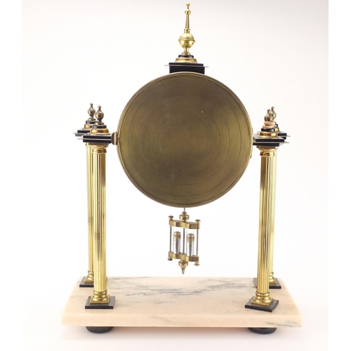 2179 - French brass drum clock striking on a gong with visible Brocot escapement, raised on four reeded col... 