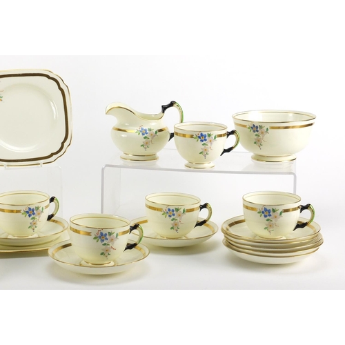 2287 - Art Deco teaware by Tuscan, decorated with flowers including trio's, two sandwich plates, milk jug a... 