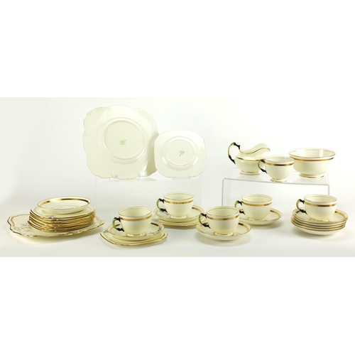 2287 - Art Deco teaware by Tuscan, decorated with flowers including trio's, two sandwich plates, milk jug a... 