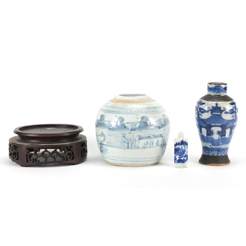 2381 - Chinese ceramics and a carved hardwood stand including a blue and white snuff bottle and a baluster ... 