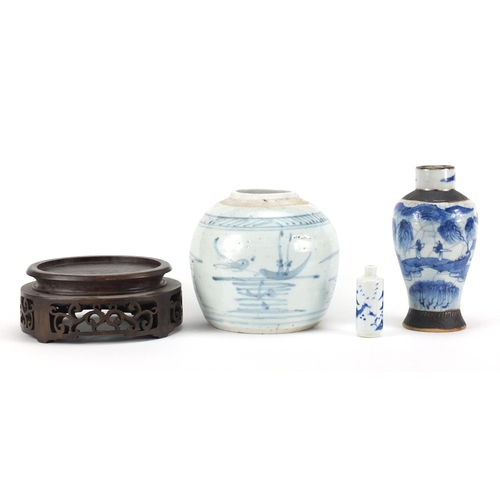 2381 - Chinese ceramics and a carved hardwood stand including a blue and white snuff bottle and a baluster ... 