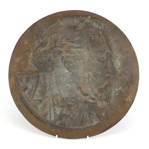 2458 - Circular patinated bronze plaque cast with a bust of Charles Dickens, 33cm in diameter