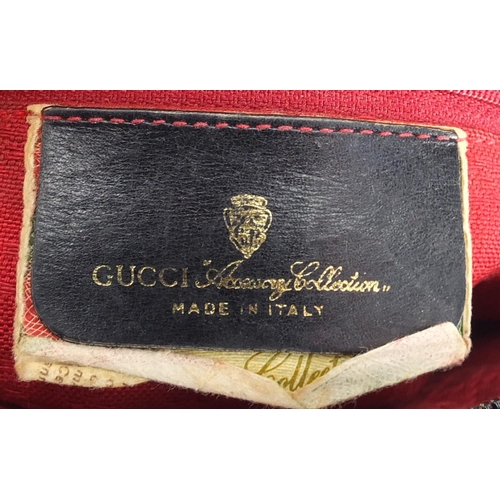 2695 - Two vintage Gucci handbags including a monogramed canvas example, one with dust bag, the largest 26c... 