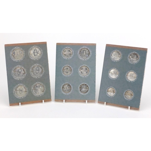 2811 - Eighteen Chinese coins housed in cardboard displays