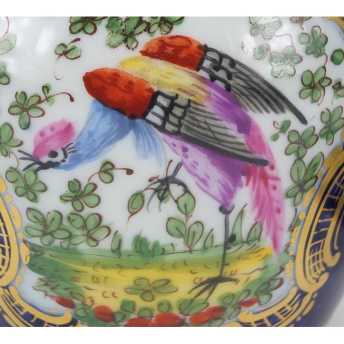 2547 - Royal Worcester blue scale cup and saucer and a similar vase and cover, both hand painted with exoti... 