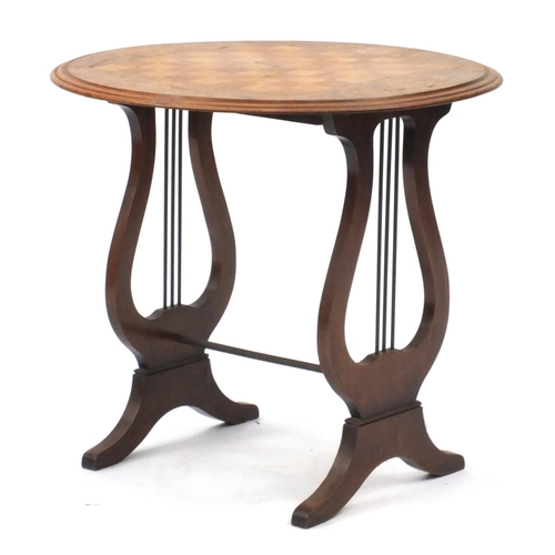 2097 - Walnut chess table with lyre supports, 46cm high x 50cm in diameter
