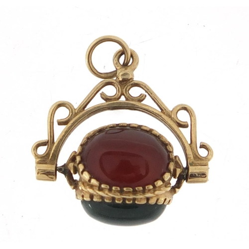 3045 - 9ct gold hardstone spinner fob, 2cm wide, approximate weight 3.4g