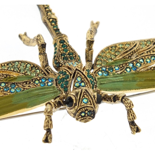 3090 - Designer gilt metal and enamel dragonfly brooch, set with green stones, 10.5cm in length