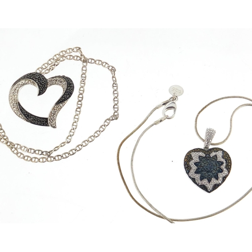 3089 - Three silver pendants on necklaces including a black and clear diamond love heart