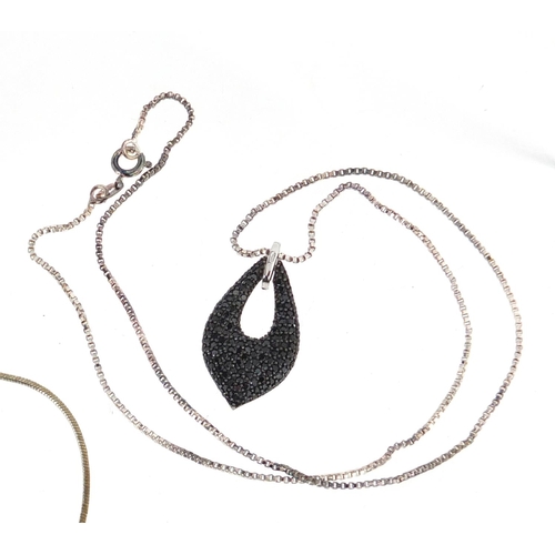 3089 - Three silver pendants on necklaces including a black and clear diamond love heart