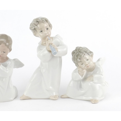 2624 - Four Lladro cherub figures, the largest 16cm high