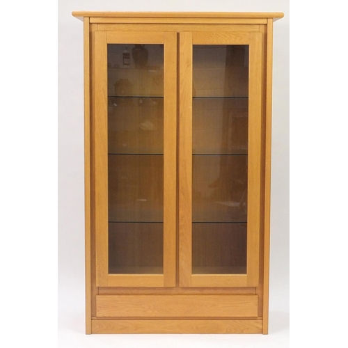 2036 - Contemporary light oak display cabinet fitted with three glass shelves and base drawer, 180cm H x 11... 