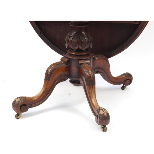 2005 - Victorian quarter veneered walnut snap top loo table, with carved column and scroll feet 77cm H x 15... 