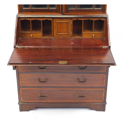 2017 - Edwardian mahogany bureau bookcase inlaid with urns and swags, fitted with a pair of astragal glazed... 