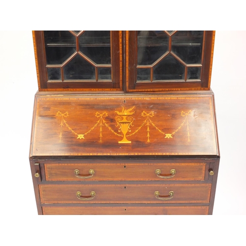 2017 - Edwardian mahogany bureau bookcase inlaid with urns and swags, fitted with a pair of astragal glazed... 