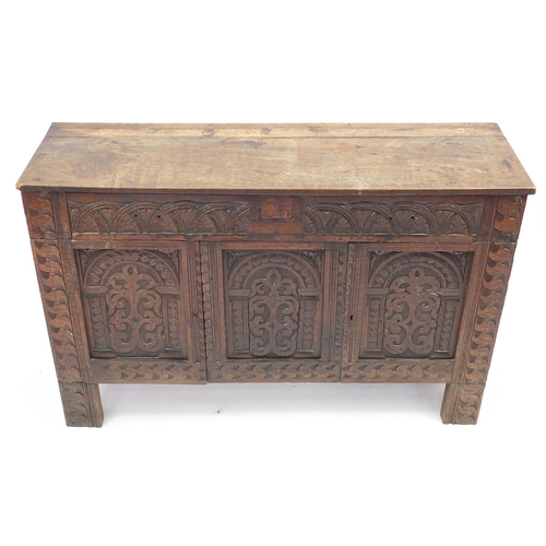 2042 - Antique oak side cabinet, with arcadian carved drawer above a pair of  carved cupboard doors, 82cm H... 