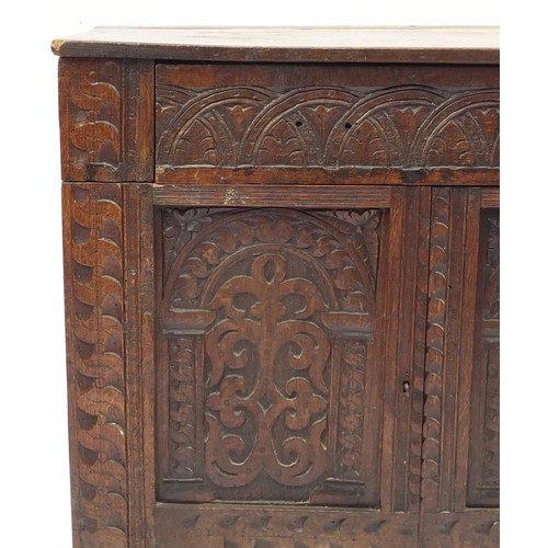 2042 - Antique oak side cabinet, with arcadian carved drawer above a pair of  carved cupboard doors, 82cm H... 