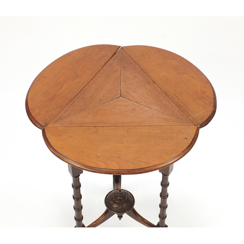 2045 - Victorian walnut and mahogany club shaped folding occasional table, raised on simulated bamboo legs,... 