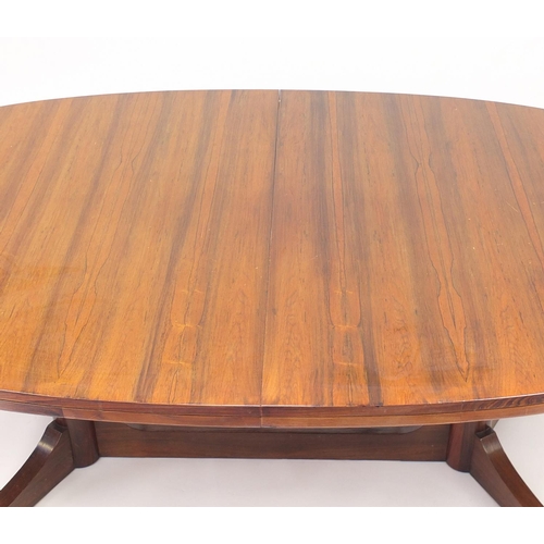 2056 - Vintage Rosewood extending dining table with extra leaf, reputably retailed by Waring & Gillow, 71cm... 