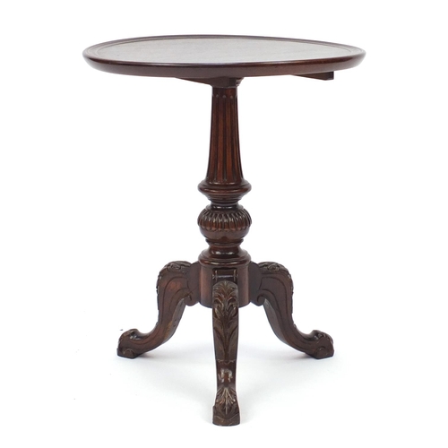 2059 - Mahogany dish top tripod occasional table, the knees carved with leaves, 63cm high x 51cm in diamete... 