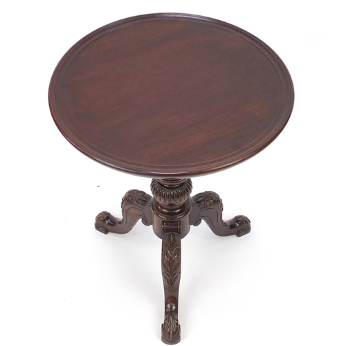 2059 - Mahogany dish top tripod occasional table, the knees carved with leaves, 63cm high x 51cm in diamete... 