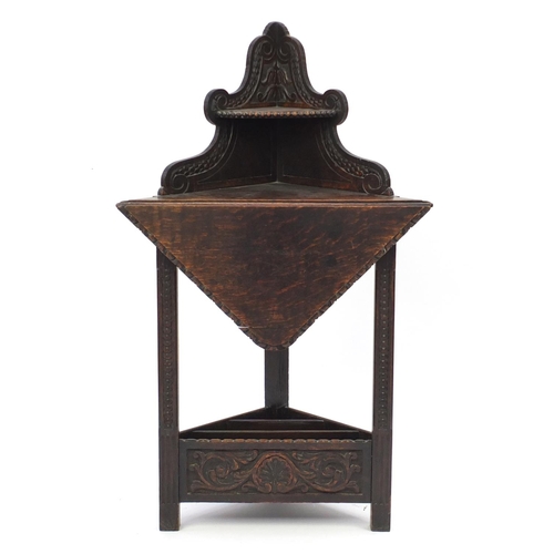 2070 - Antique oak drop leaf corner stand with magazine rack to the base, 130cm h x 76cm W x 54cm D