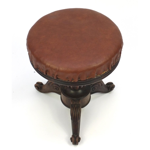 2071 - Victorian carved mahogany adjustable piano stool, with brown leather top and scroll feet, 48cm high