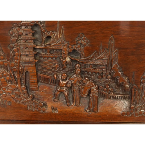 2076 - Chinese camphorwood drinks cabinet carved with figures and pagodas, raised on dragon claw feet, 89cm... 