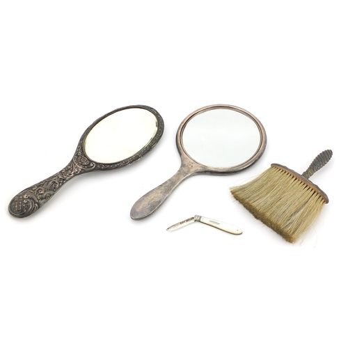 2864 - Silver items comprising two hand mirrors, a clothes brush and mother of pearl flanked folding pocket... 